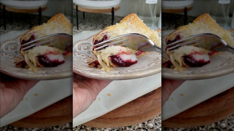 Eating Aldi cherry mascarpone strudel with fork