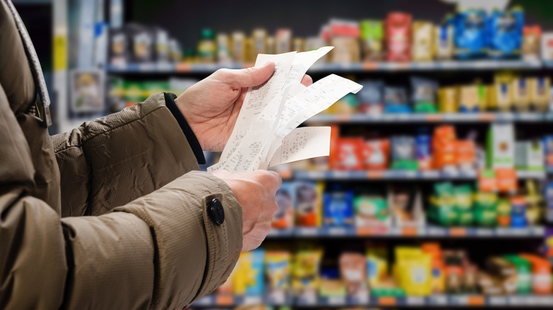 Person viewing receipts