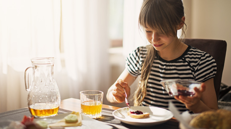 child with apple juice