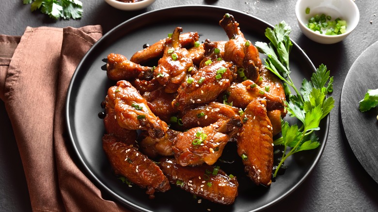 A plate of honey-glazed chicken wings