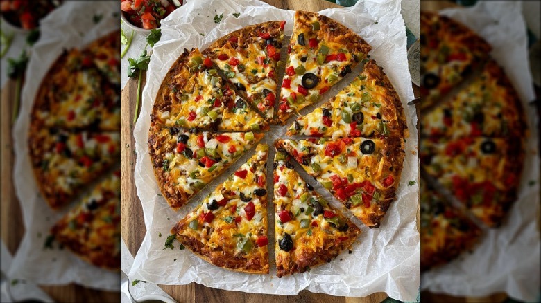 Aldi pizza with veggies sliced