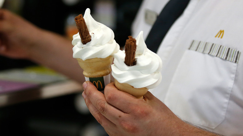 Man holding McDonald's ice creams