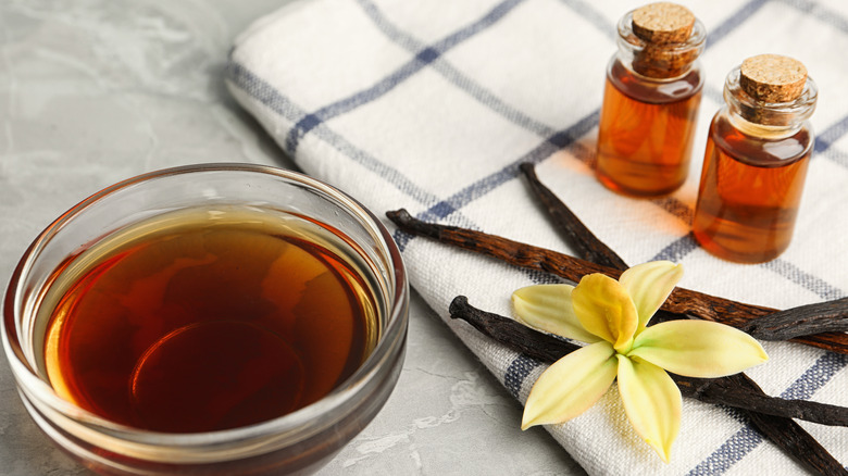 vanilla extract in bottles and bowl