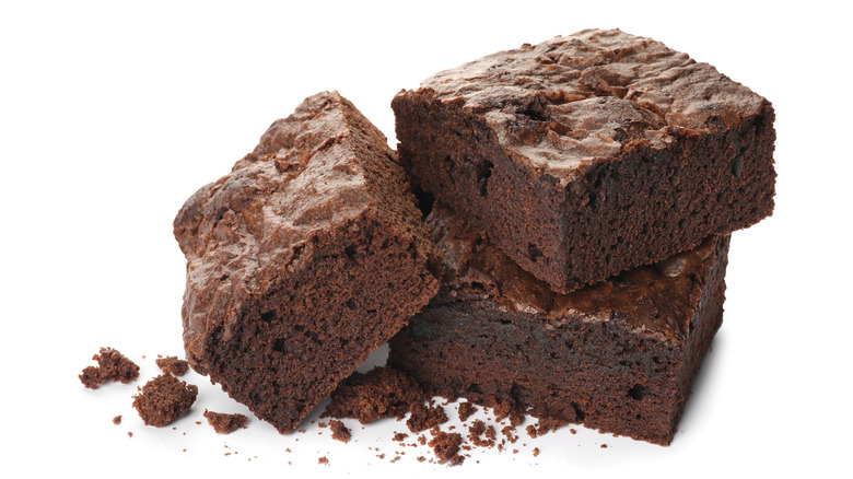 Stack of three Chocolate brownies on white background
