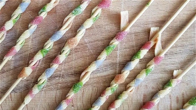 Colorful busiate pasta on skewers