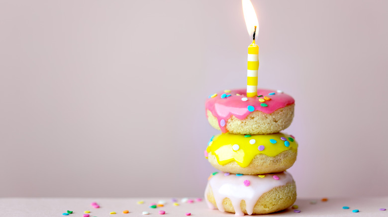 donuts stacked with birthday candle