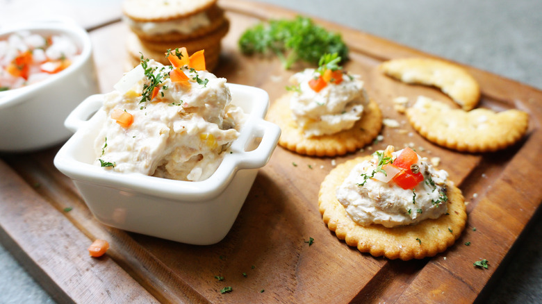 fish dip on serving board with crackers