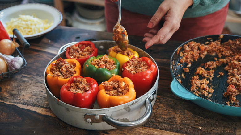 filling peppers with ground beef