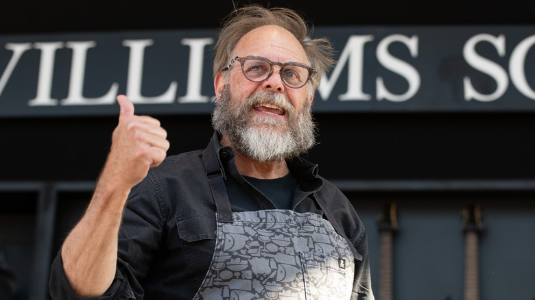 Alton Brown wearing apron