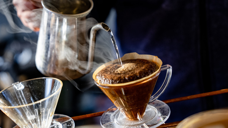 pouring water into coffee cone