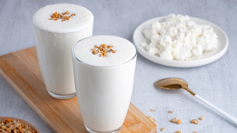 Lassi drinks in glasses with granola