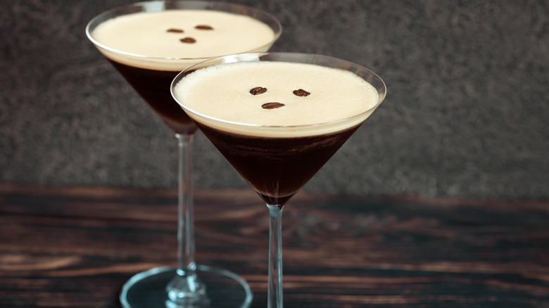 two espresso martinis on brown and grey background