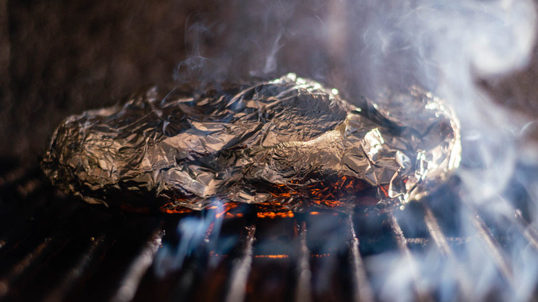Foil pouch on hot grill