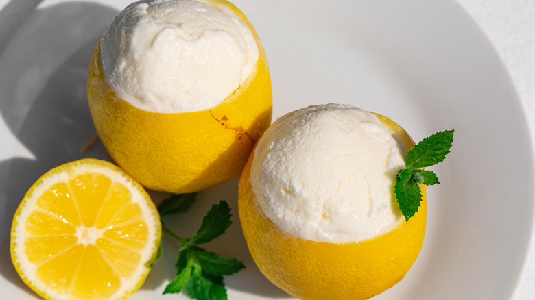 Yellow lemon cups and white ice cream