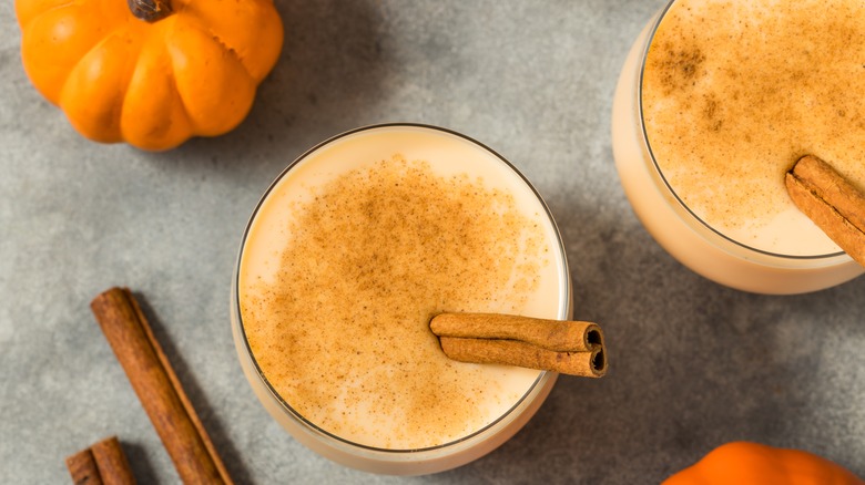 glasses of eggnog and pumpkins