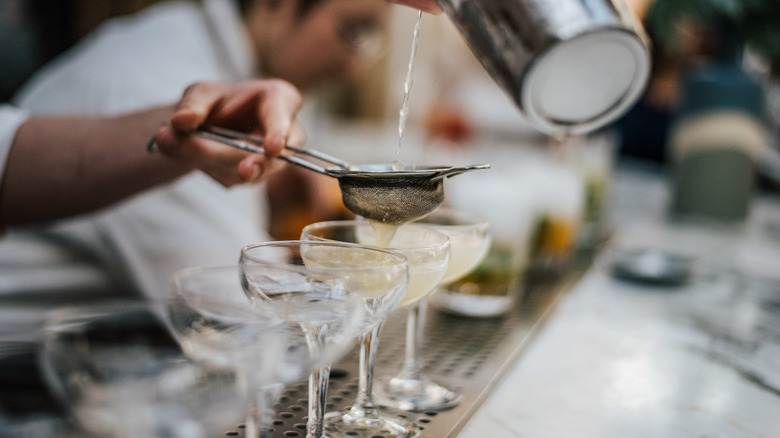 Bartender making martinis