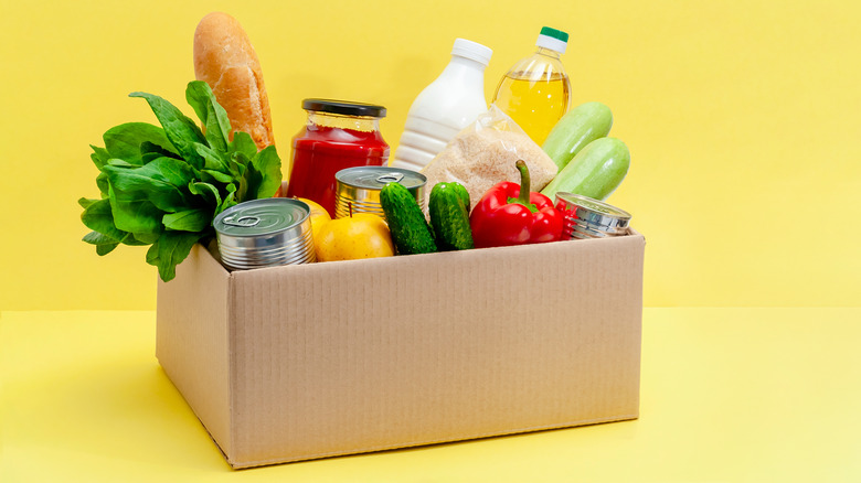 Cardboard box filled with generic food and produce