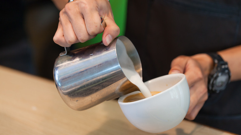 Starbucks barista making drink