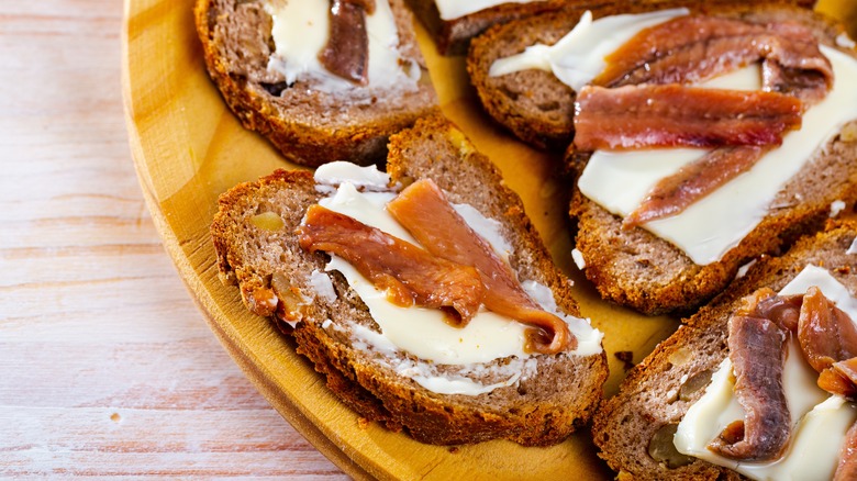 Platter of anchovy toasts with butter