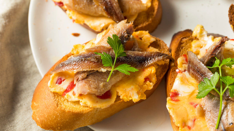 Anchovy toast with pepper butter and herbs