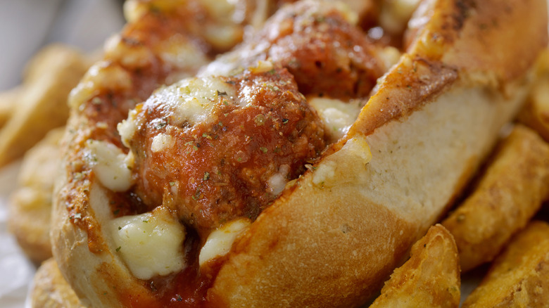 close-up meatball sub with melted cheese