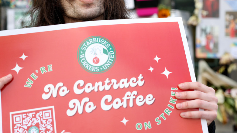 Starbucks protester holding sign