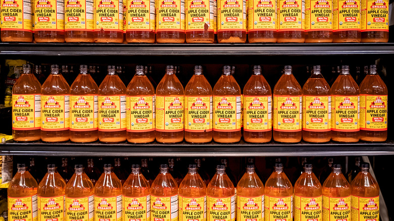 shelves of Bragg's apple cider vinegar