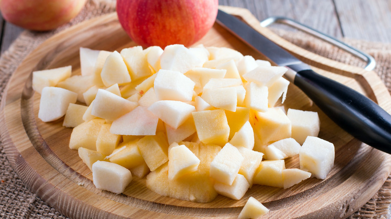 Cubed apple on a wooden board