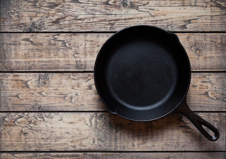 What shouldn't you cook in a cast-iron pan?