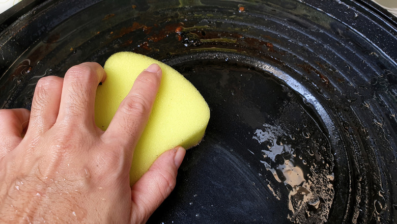 How do you clean a cast-iron pan?