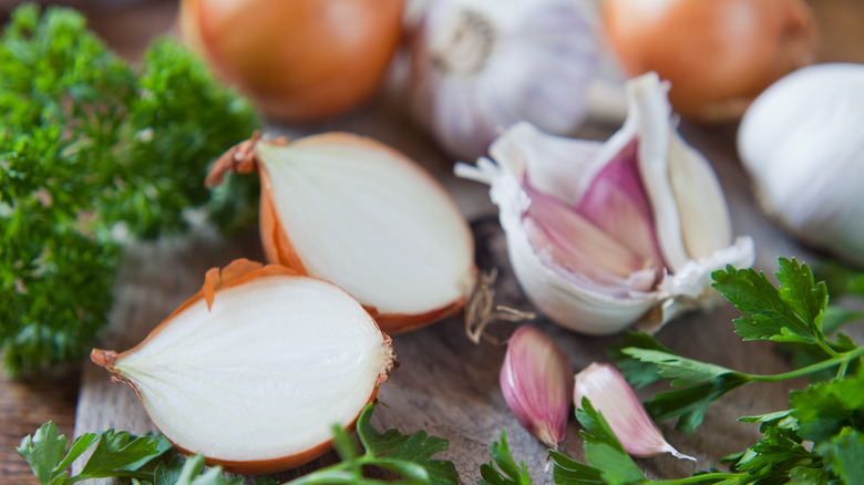 Onions and leafy greens on a platter