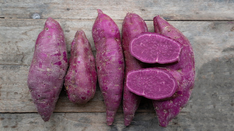 purple sweet potatoes on wooden tabletop