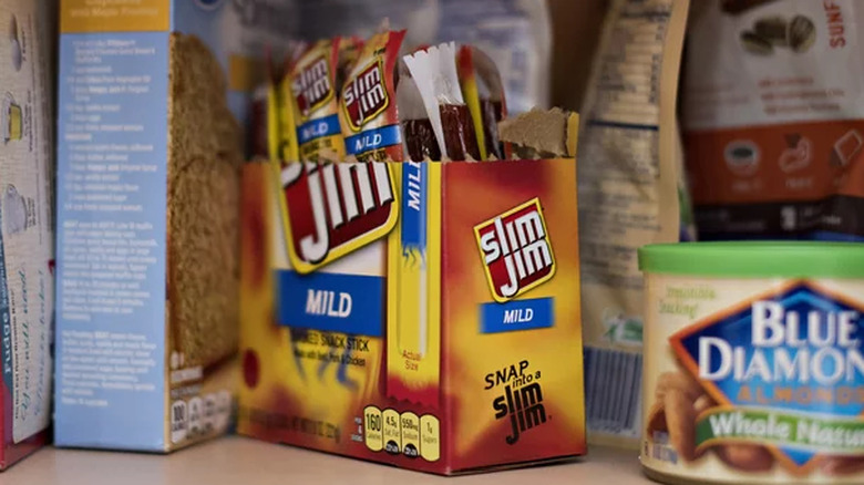 Open box of Slim Jims on pantry shelf