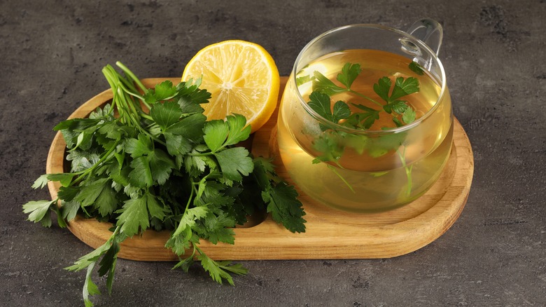 Mug of parsley tea with lemon slices from above