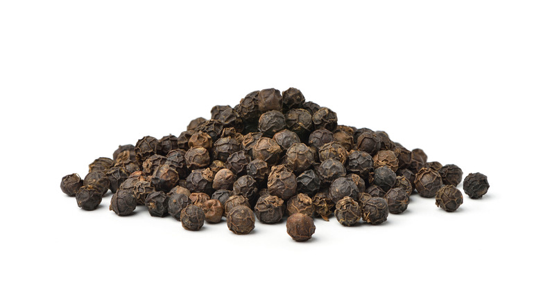 pile of black peppercorns