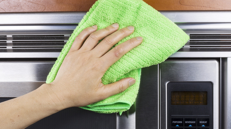 Wiping down a microwave