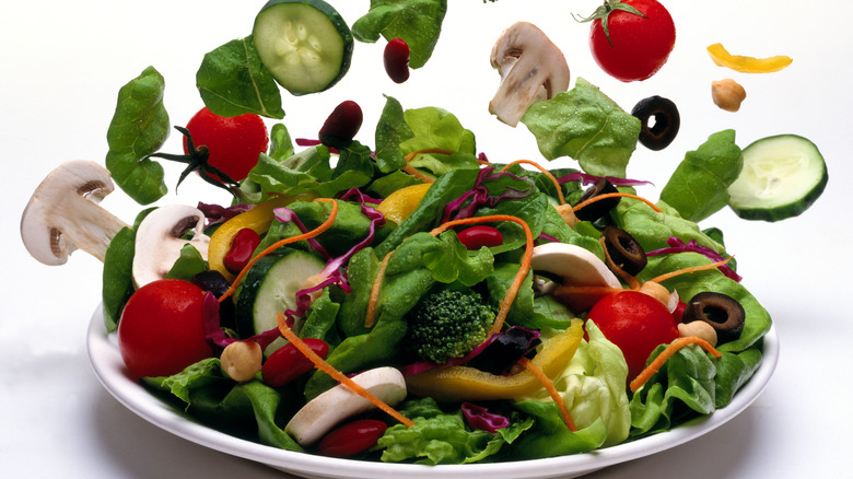 Variety of colorful veggies and fruit in salad