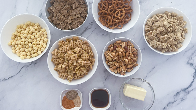 Chex mix ingredients in bowls