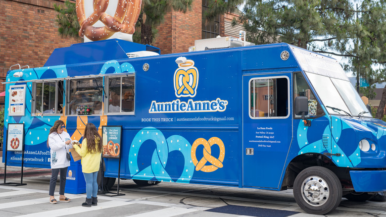 Customers visiting Auntie Anne's food truck