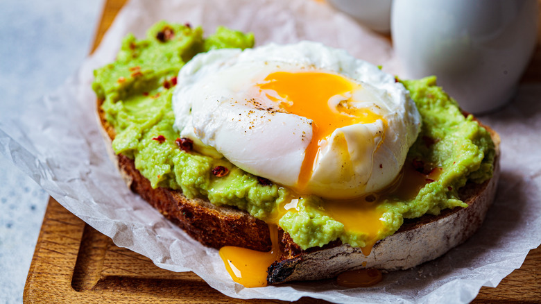 Toast with avocado and a poached egg on top