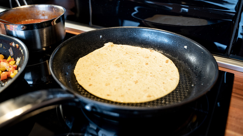 Tortilla in pan on stovetop