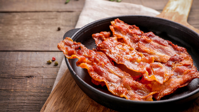 Pan of cooked bacon slices