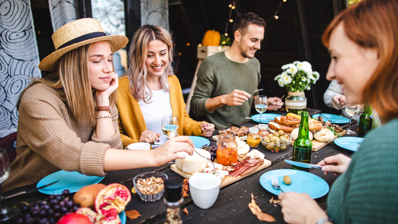 eating cheese at party