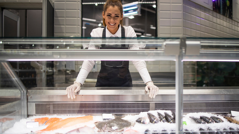 Supermarket fish worker