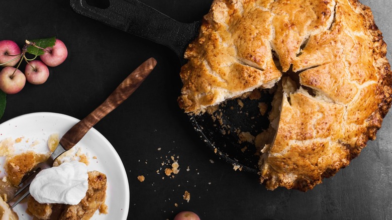 apple pie in a cast-iron skillet with a bacon grease crust