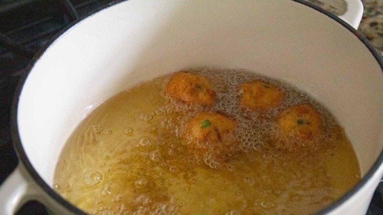 hush puppies frying in hot oil