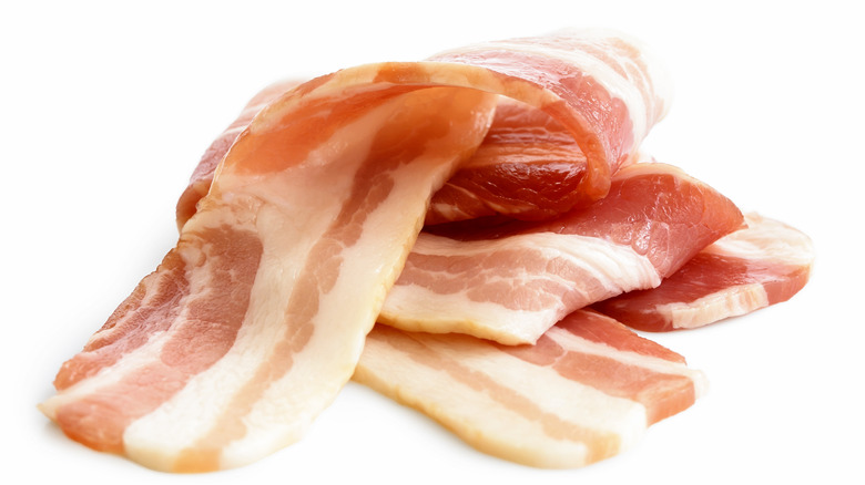 Uncooked bacon strips