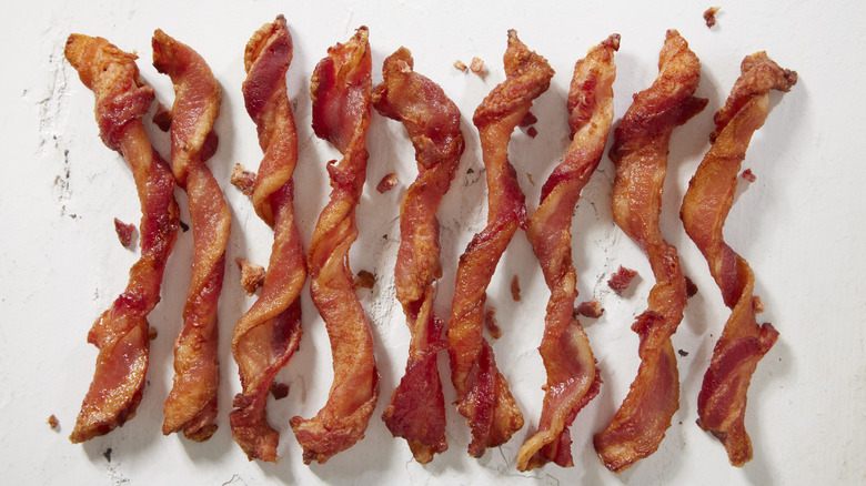 Twisted strips of thick-cut bacon