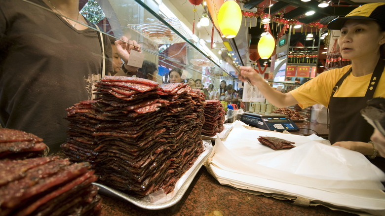 Bak Kwa stacked on a counter in a market stall