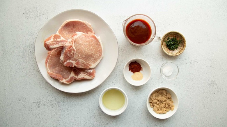 raw pork chops with seasonings